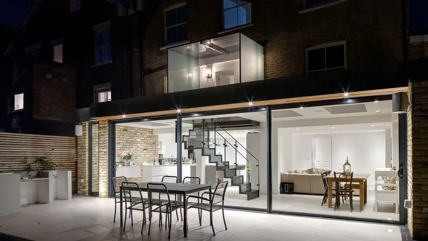 Rose Brentwood Four Storey Refurbishment Contemporary Basement Extension glass box extension roof Alfreso Dining Night Time View