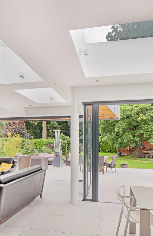 Bowhay Hutton Mount Shenfield Contemporary Extensions and Refurbishment Open Plan Bifold Doors with modern landscaped garden and patio on split levels