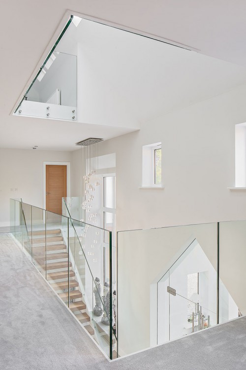 Noodles Hutton Mount Shenfield 645m New Build Hybrid Design Home stunning hallway entrance glass stairway gallery glass landing natural light