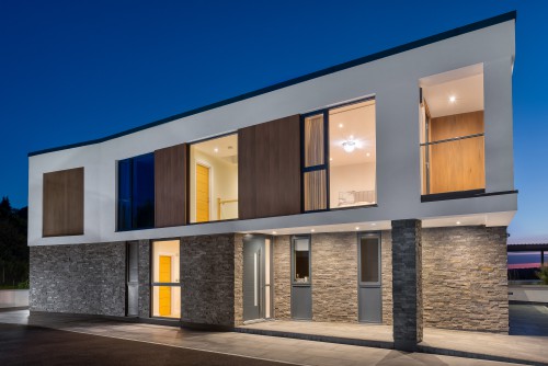 2.North Tye Swanley New Build Contemporary Home corner front view grey stone cladding timber cladding white render full view