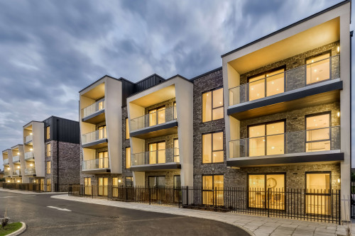 Moreton bay apartments romford open plan living sustainability eco friendly award winning modern full view nightligths architects car park entrance