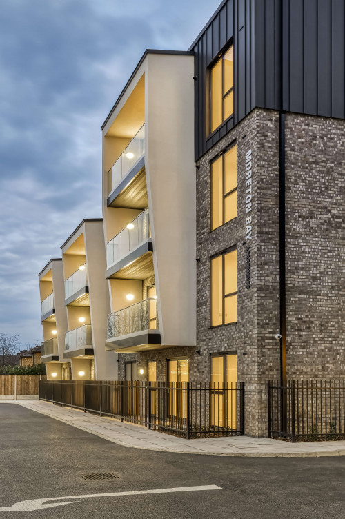 Moreton bay apartments romford open plan living sustainability eco friendly award winning modern portrait balcony zinc glass metal sign