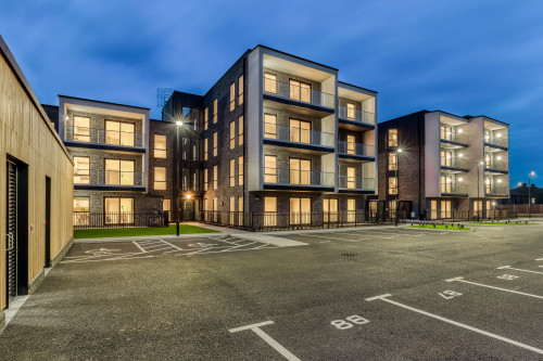 Moreton bay apartments romford open plan living sustainability eco friendly award winning modern substation wood panel nightwiew carpark architects garden landscape